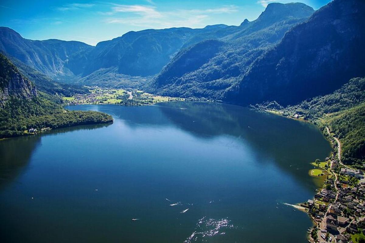 an aerial view of a lake in the mountains