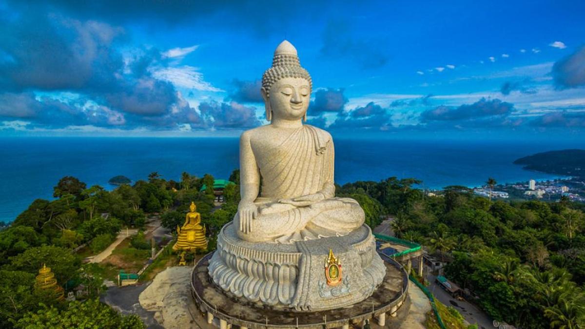 a large statue sitting on top of a mountain