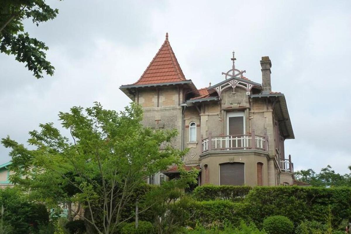 an old house with a tower on top of it