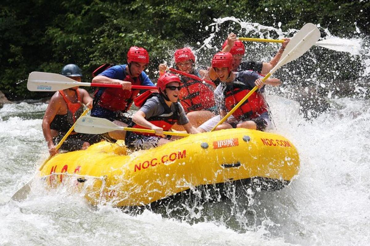 a group of people on a raft in the water