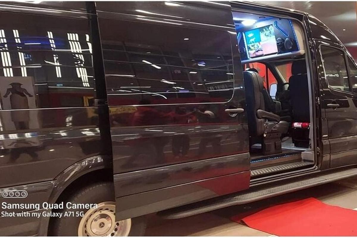 a black van with its door open on a show