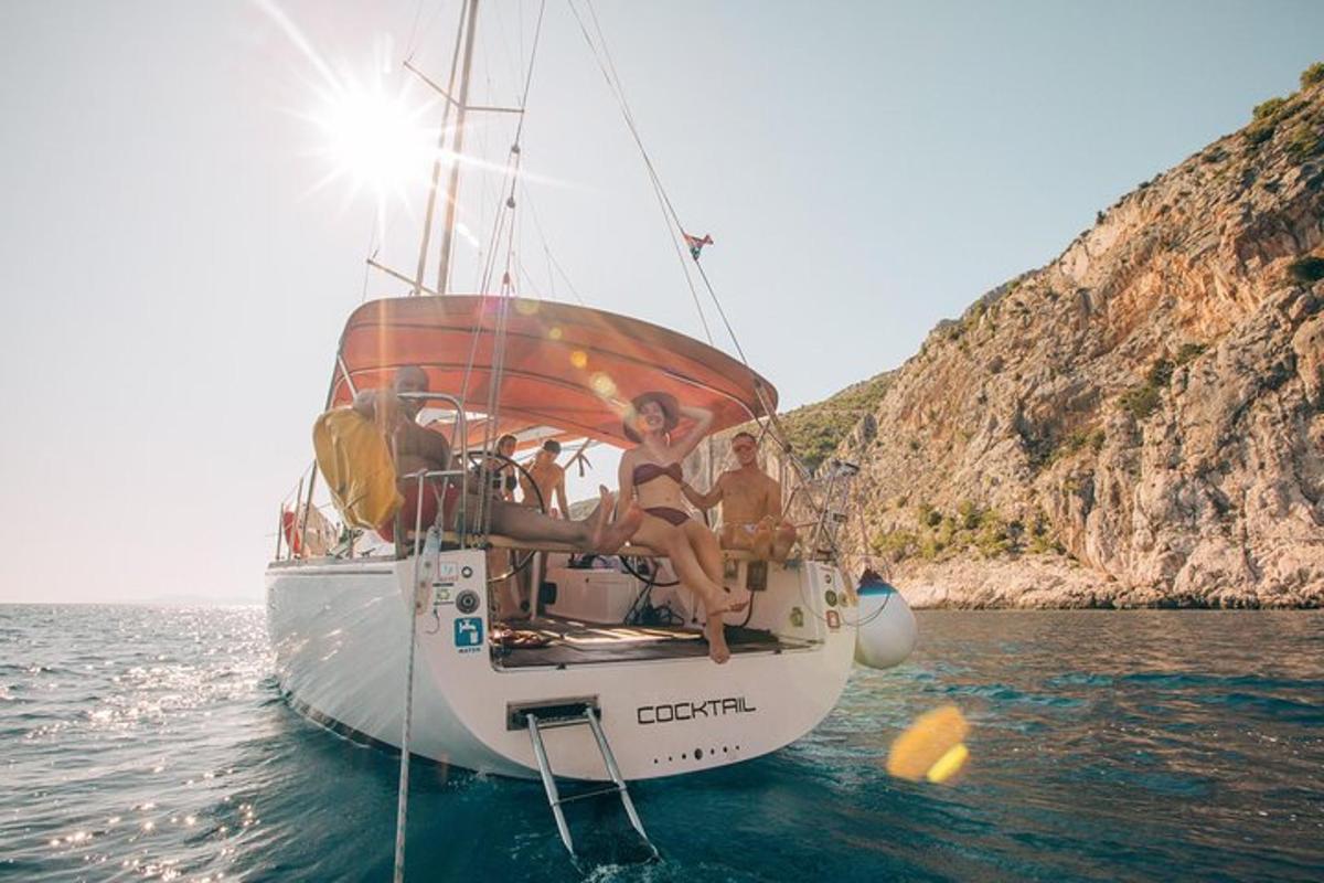a group of people sitting on a boat in the water