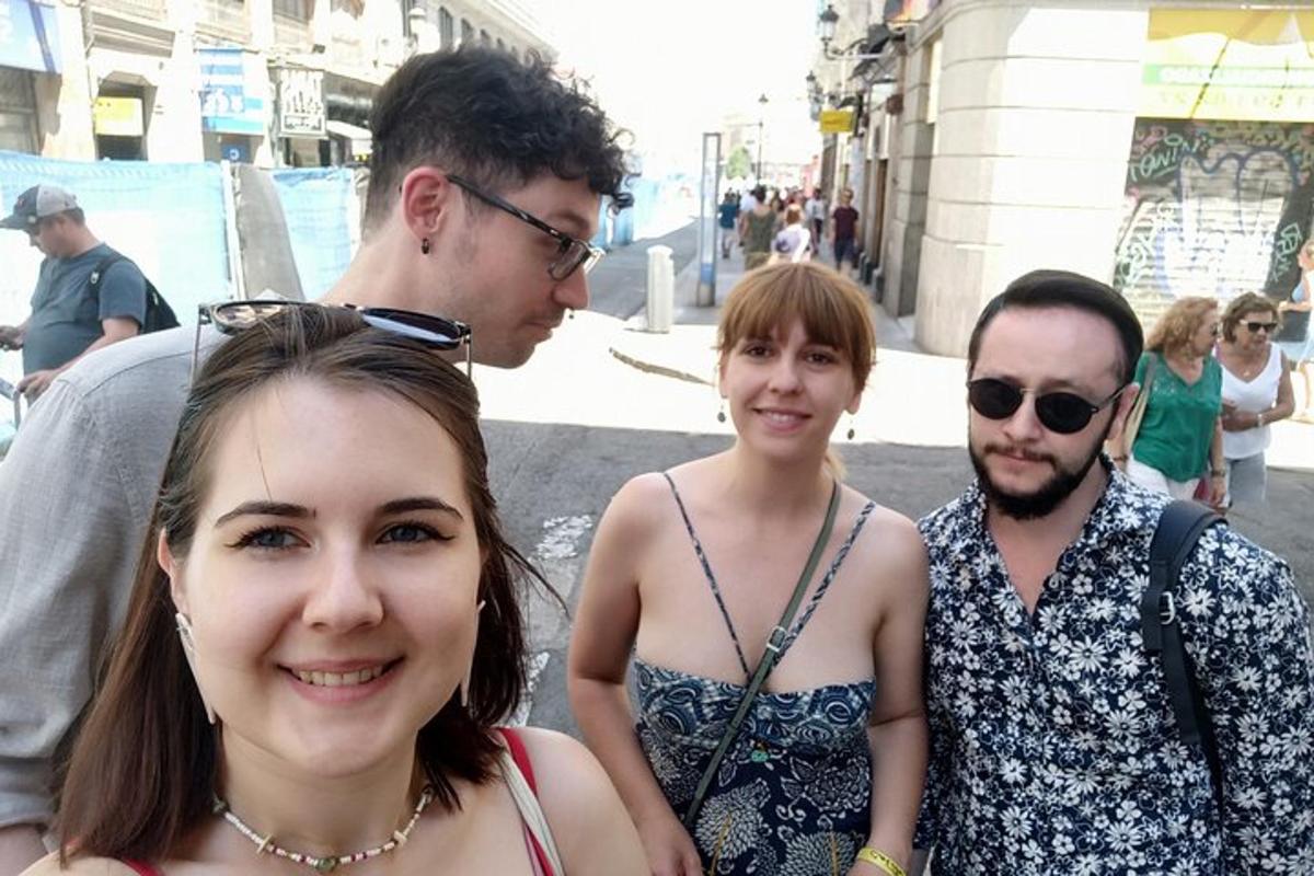 a group of people standing on a city street