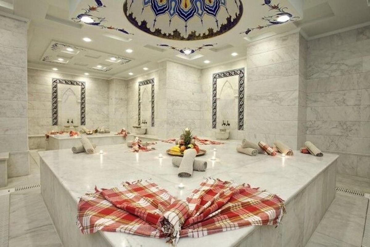 a large white room with a table and chairs