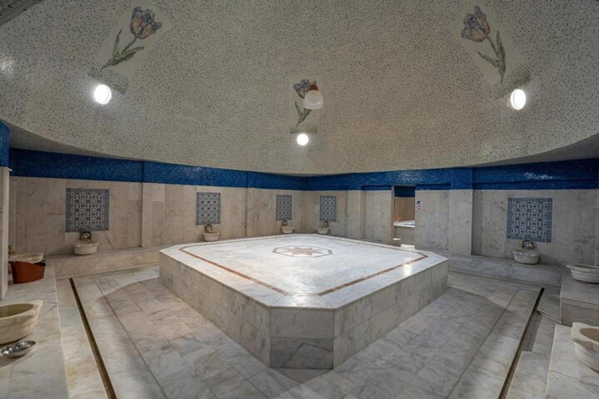 a large room with a large bed in the middle