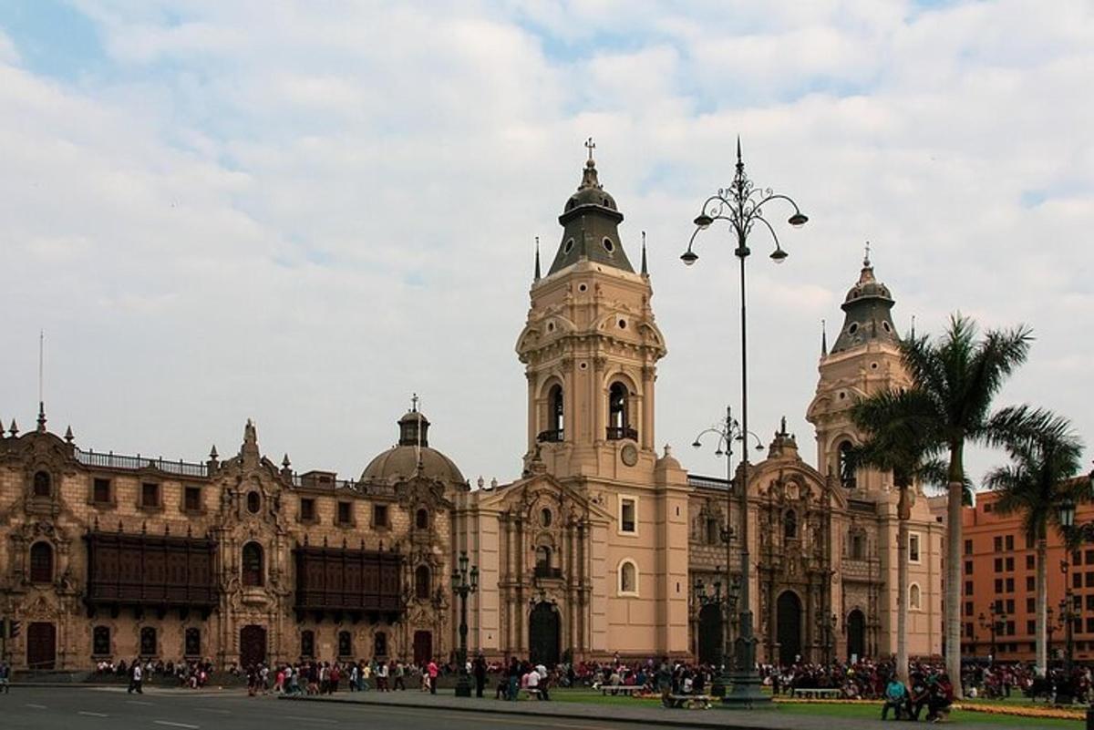 a large building with a clock tower in front of it