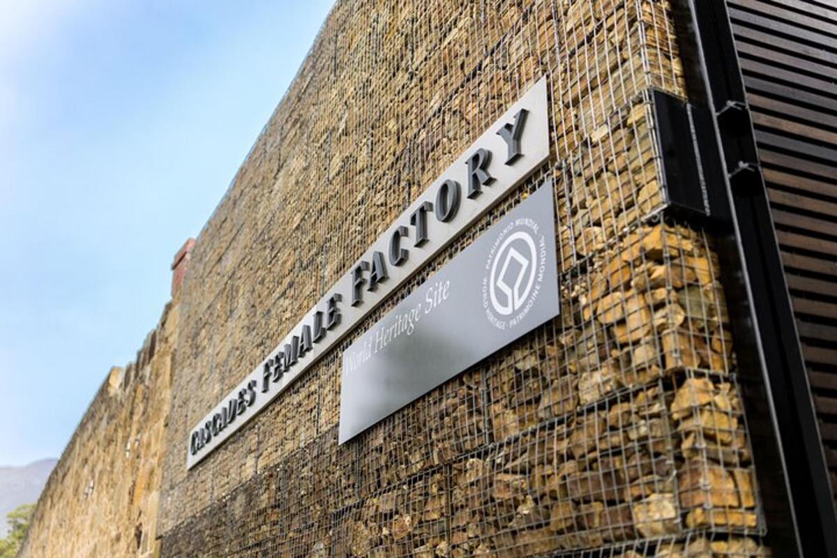 a street sign on the side of a brick building