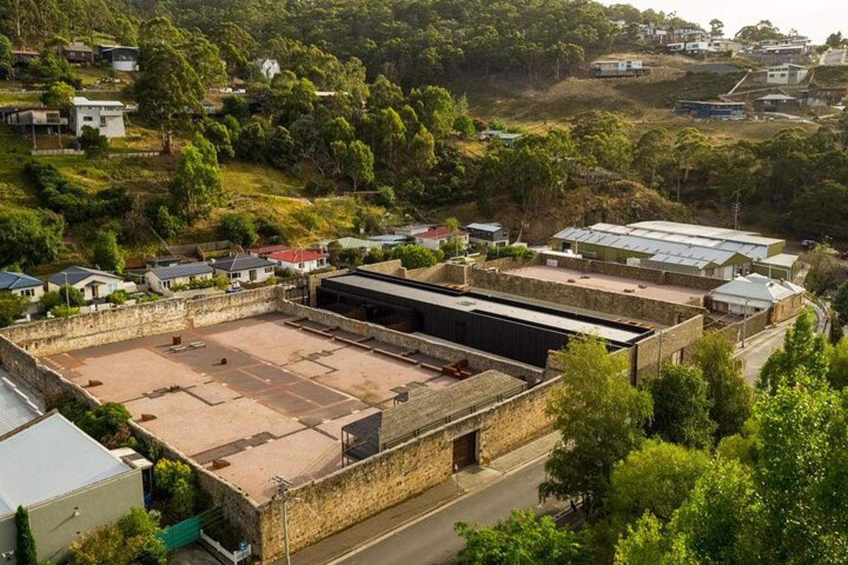 an aerial view of a building with a parking lot
