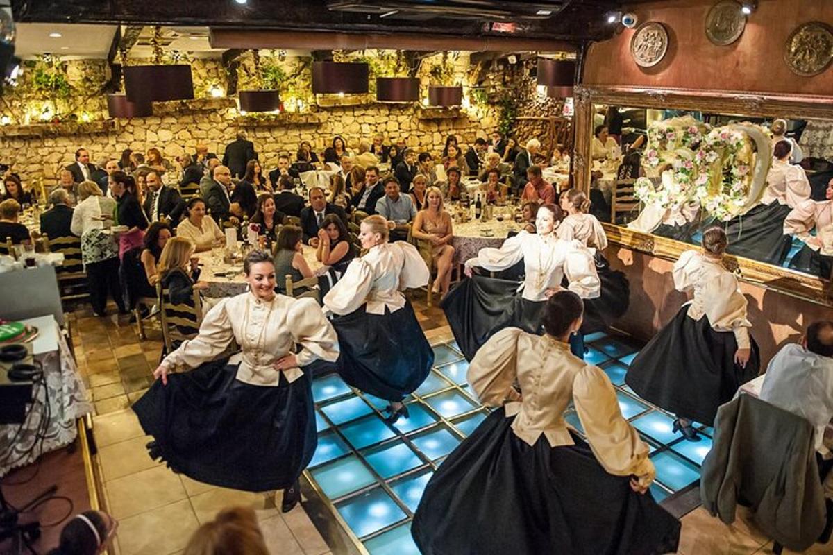 a group of people dancing in front of a crowd