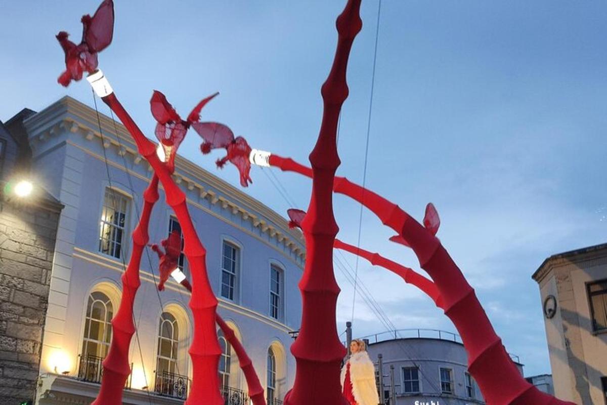 a group of red ribbons in front of a building