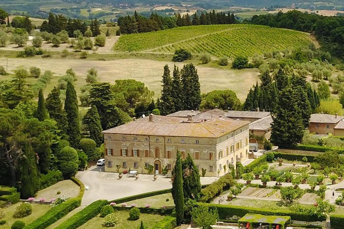 an aerial view of a large building with a garden