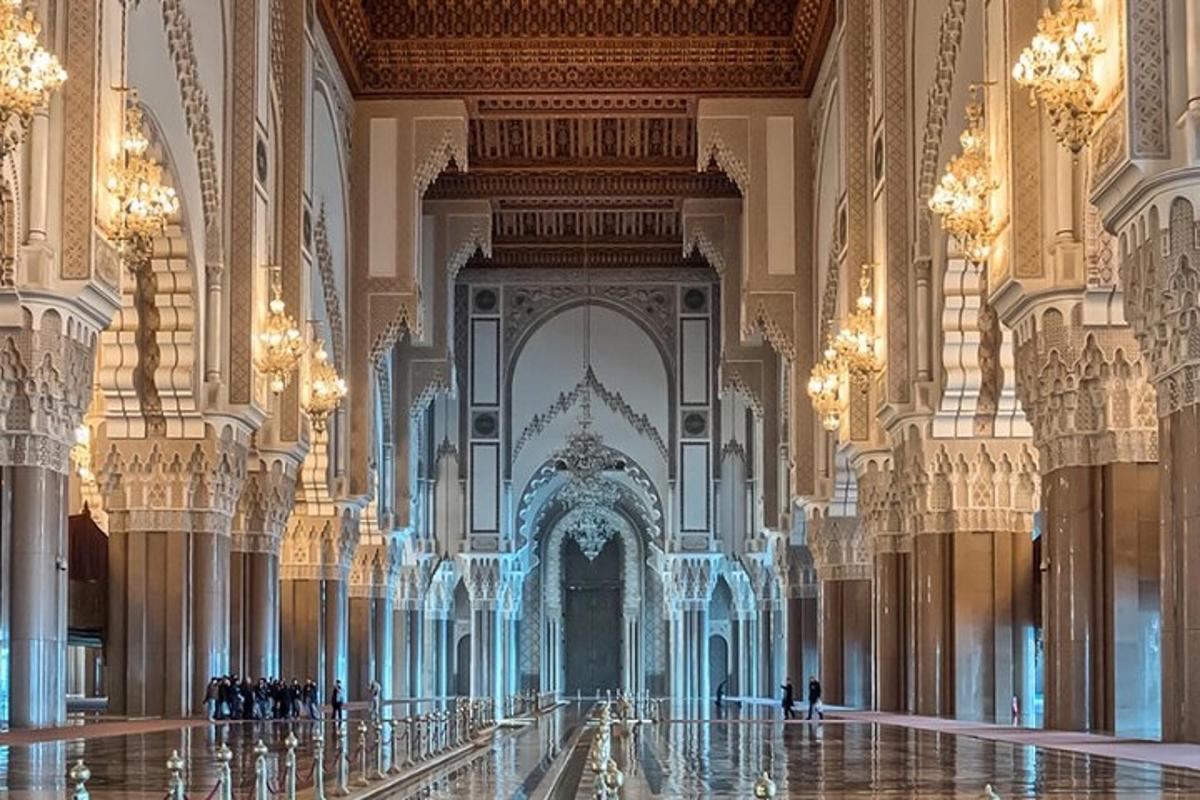 a hallway in a large building with chandeliers