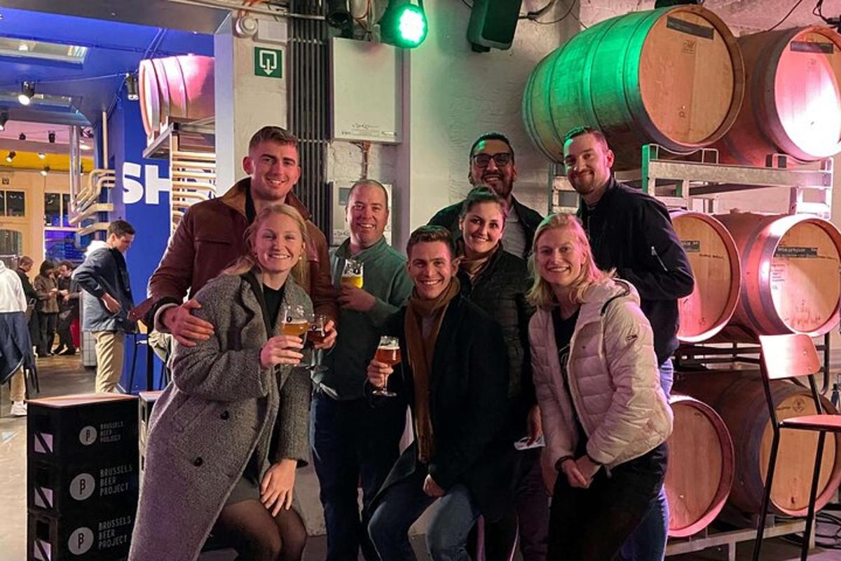 a group of people posing for a picture with wine glasses