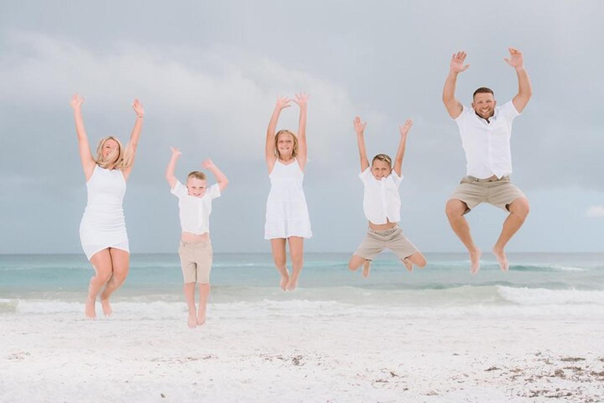 a family jumping in the air on the beach