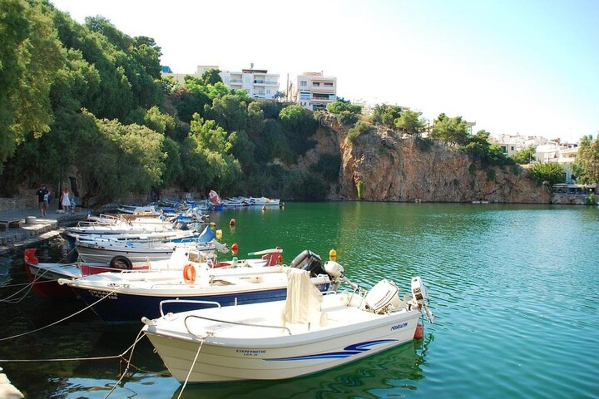 a group of boats docked in a body of water