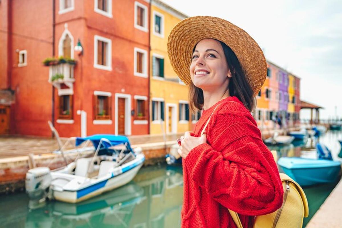 a woman wearing a hat standing next to a marina