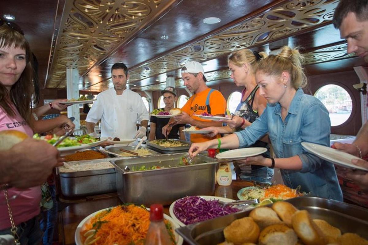 a group of people preparing food in a kitchen
