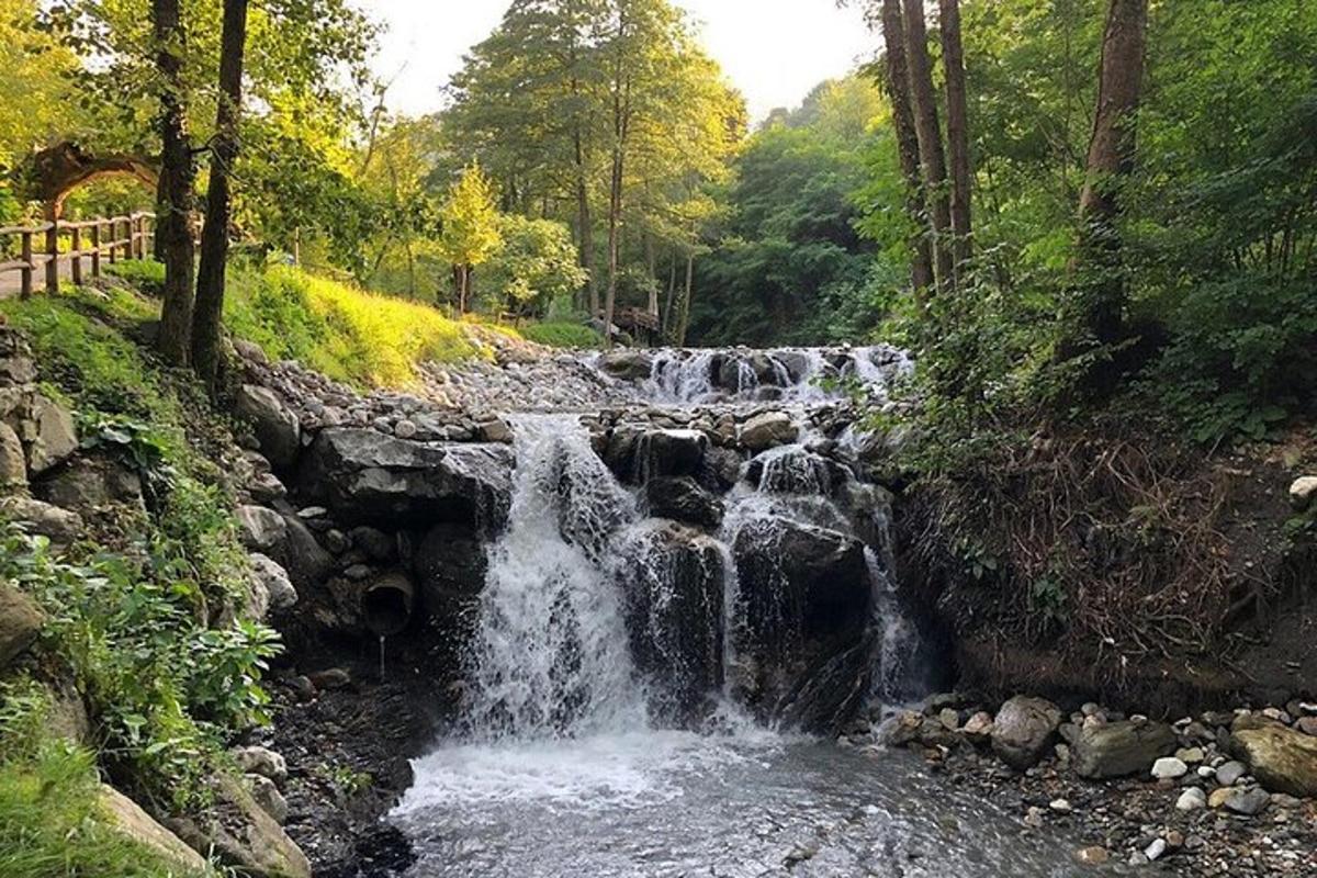 a waterfall in the middle of a river