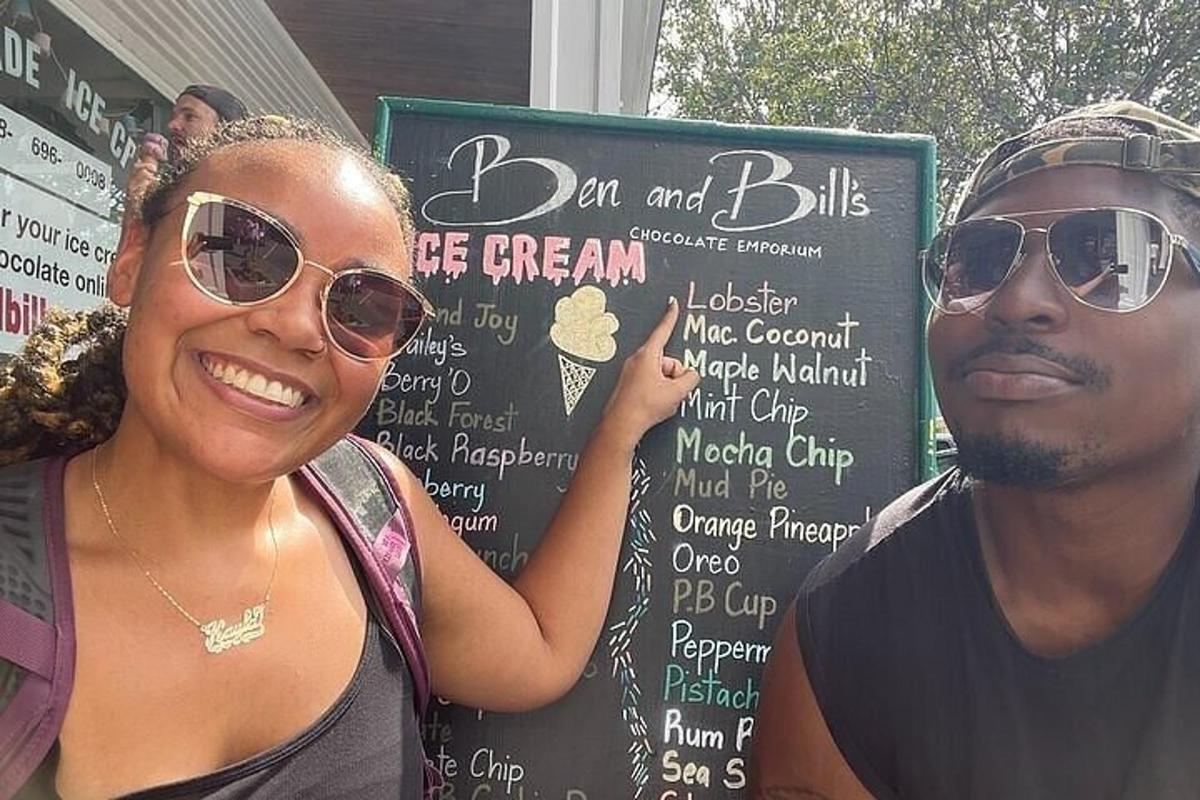 a man and a woman standing in front of a sign