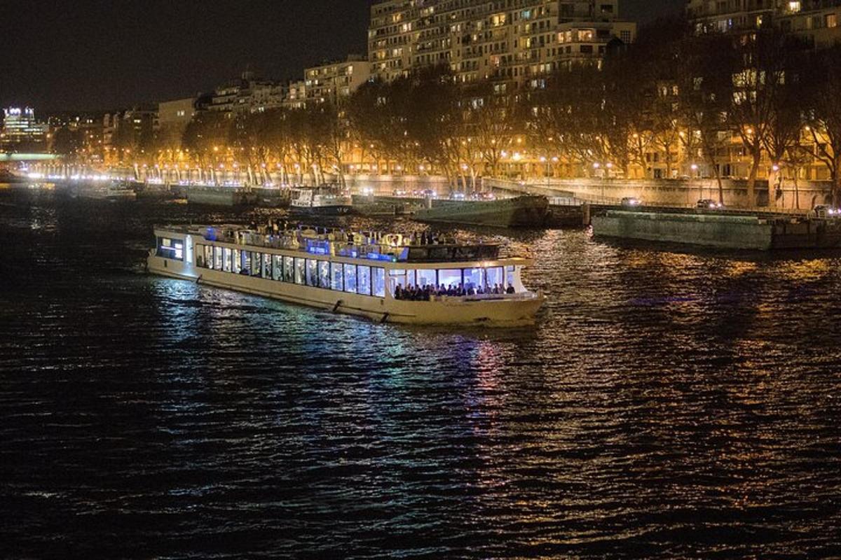 a boat in the water with lights on it at night