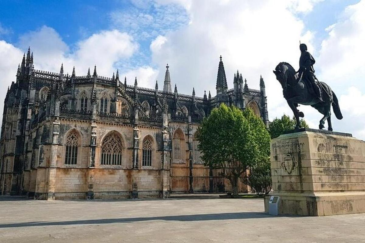 a statue of a man on a horse in front of a building