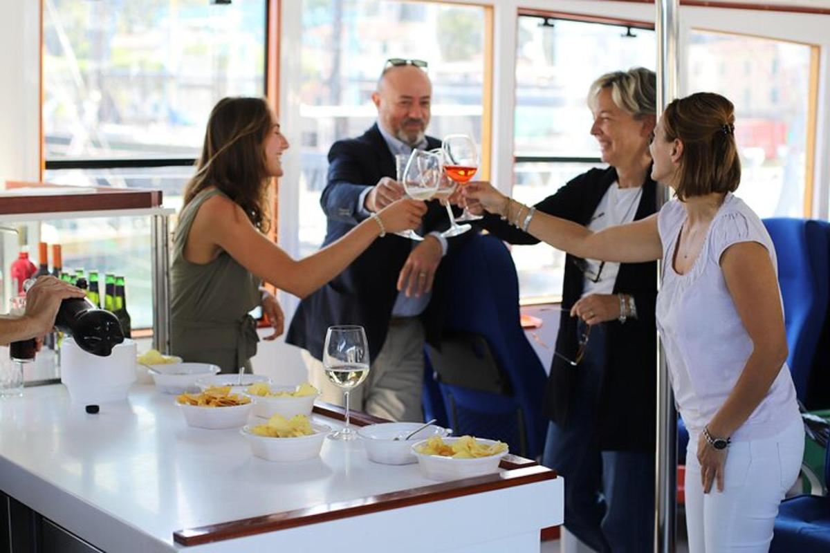 a group of people standing around a table with wine glasses