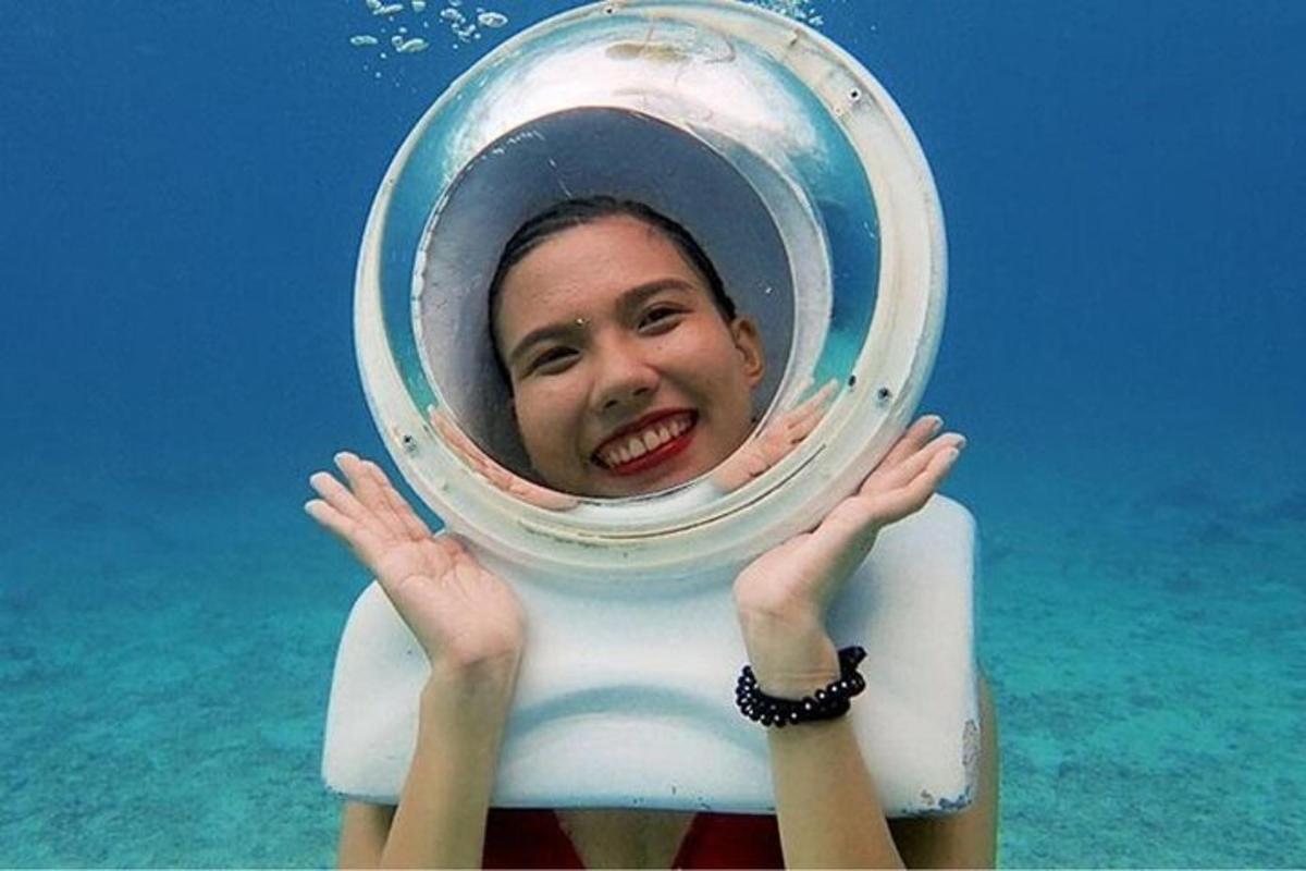 a young woman in the water on a wave pool