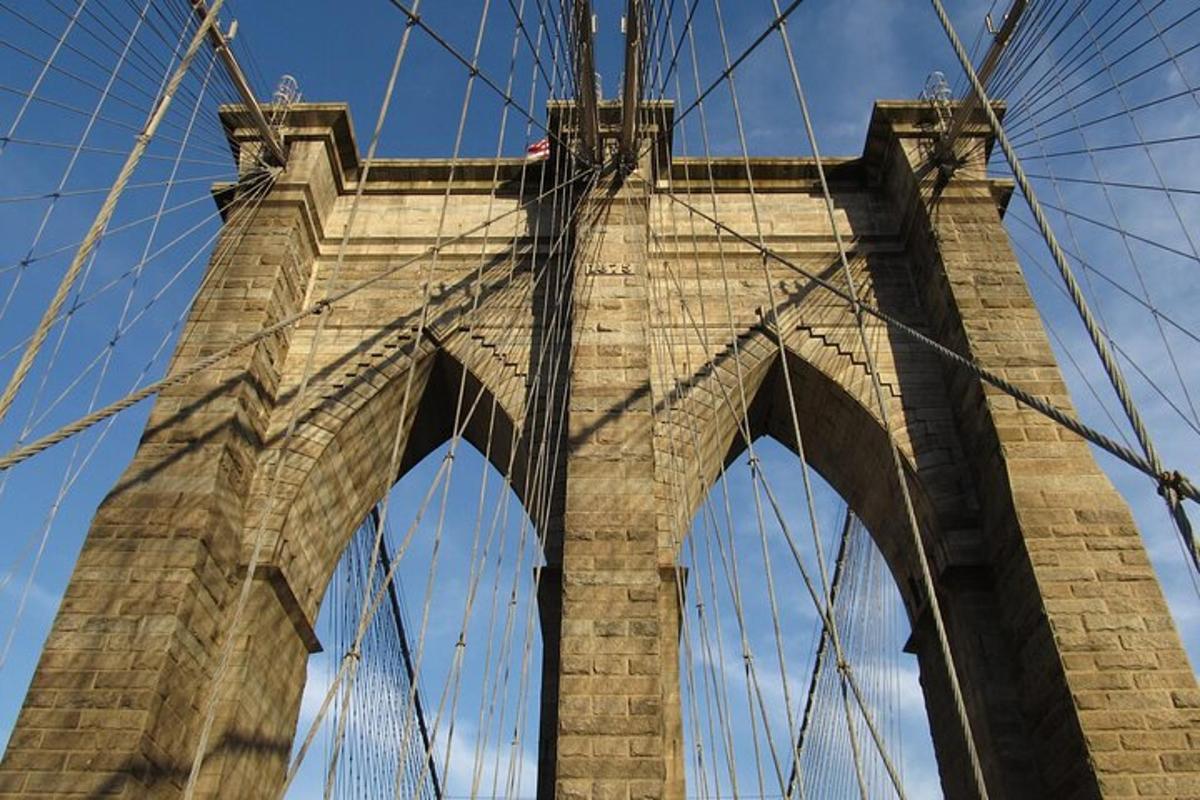 a view of a brooklyn bridge from below