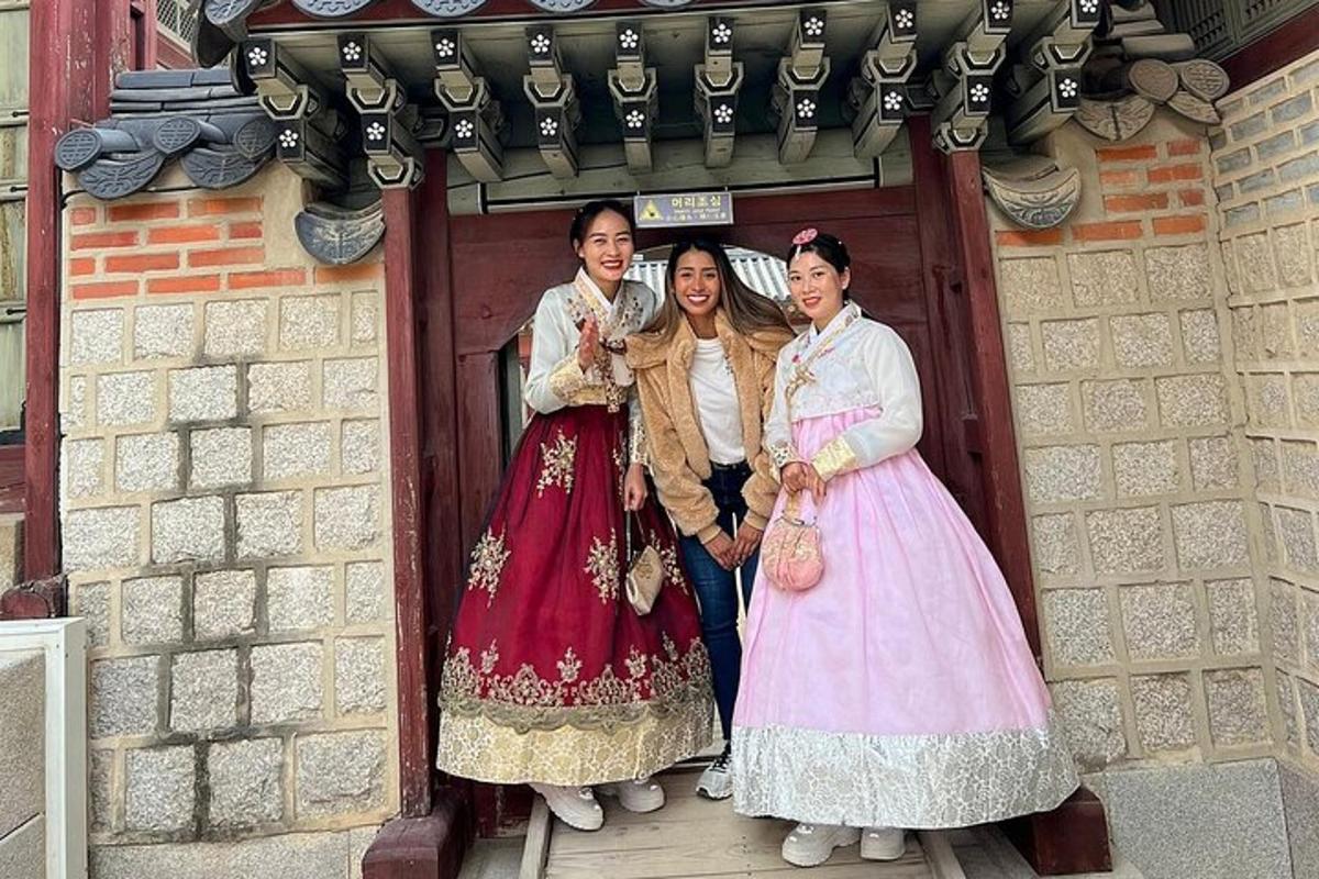 a group of three women standing in a doorway