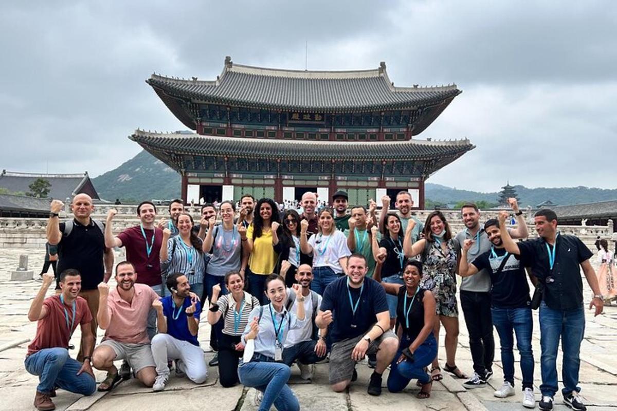 a group of people posing in front of a building