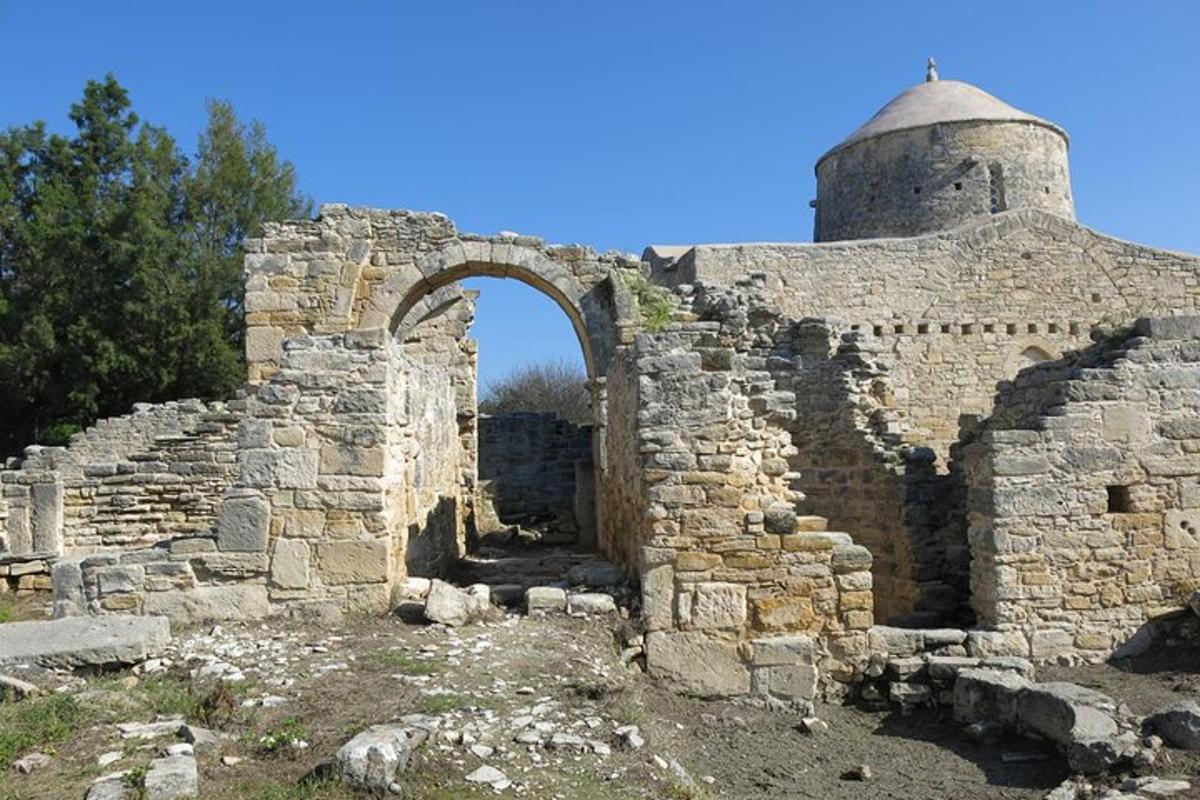 an old building with an arch and a tower