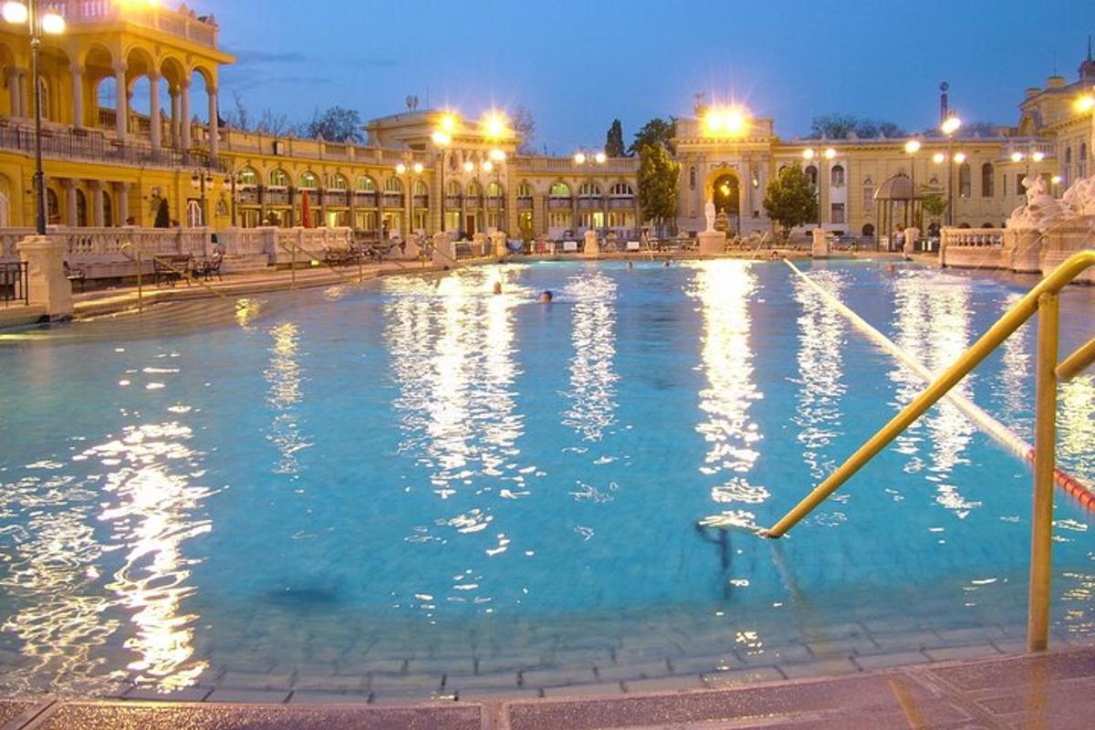 a large swimming pool in a building at night