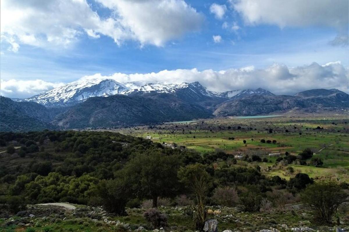 a view of a mountain range with snow covered mountains