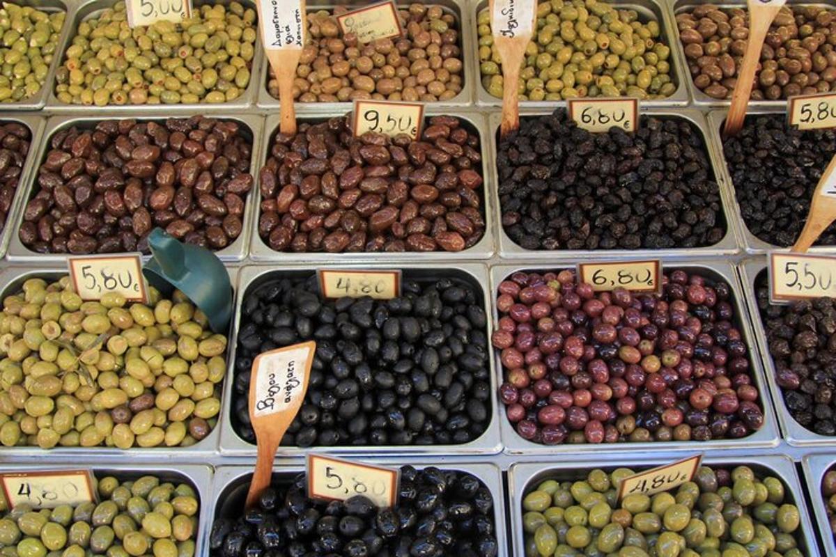 a display of different types of olives in boxes