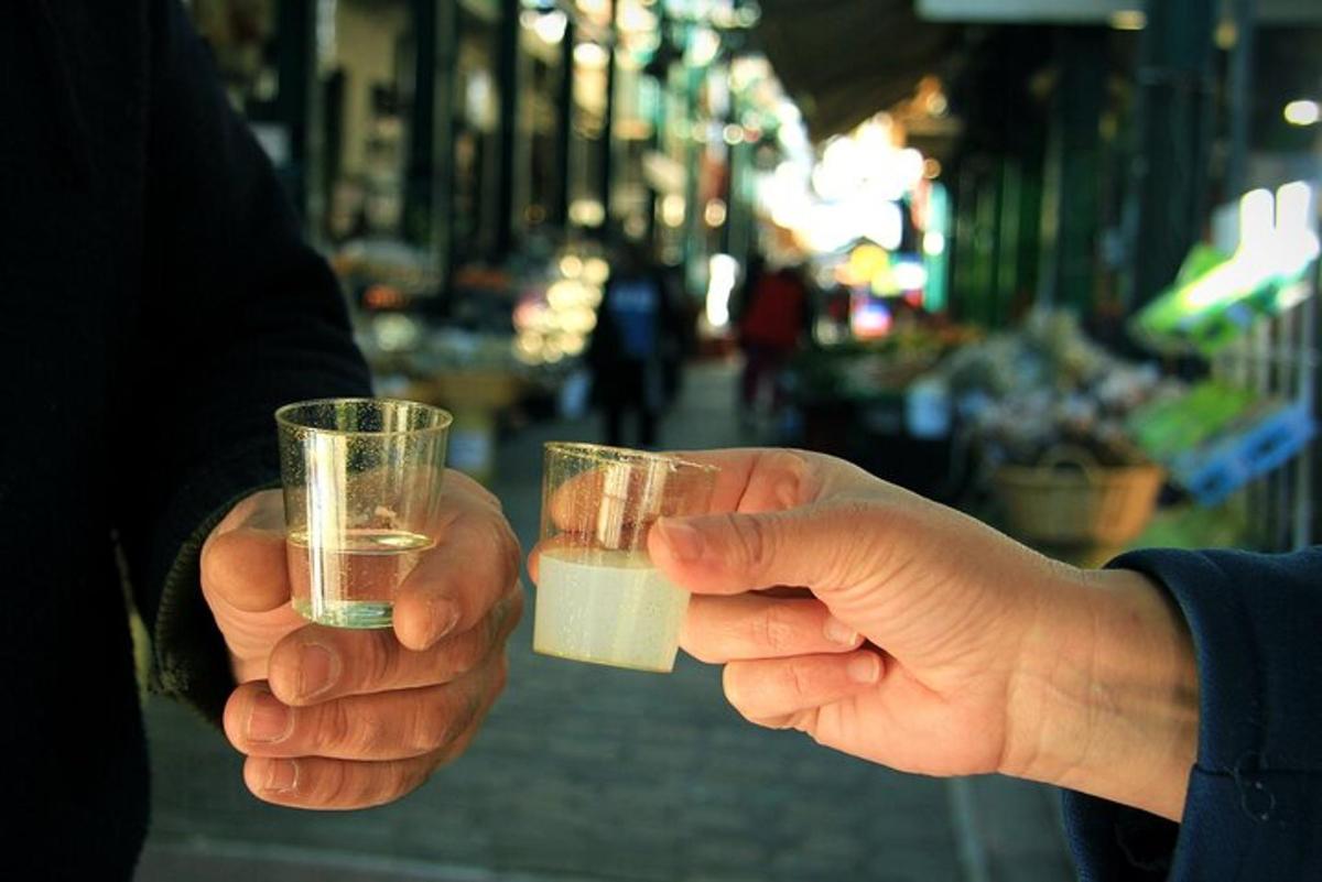 two people holding drinks in their hands