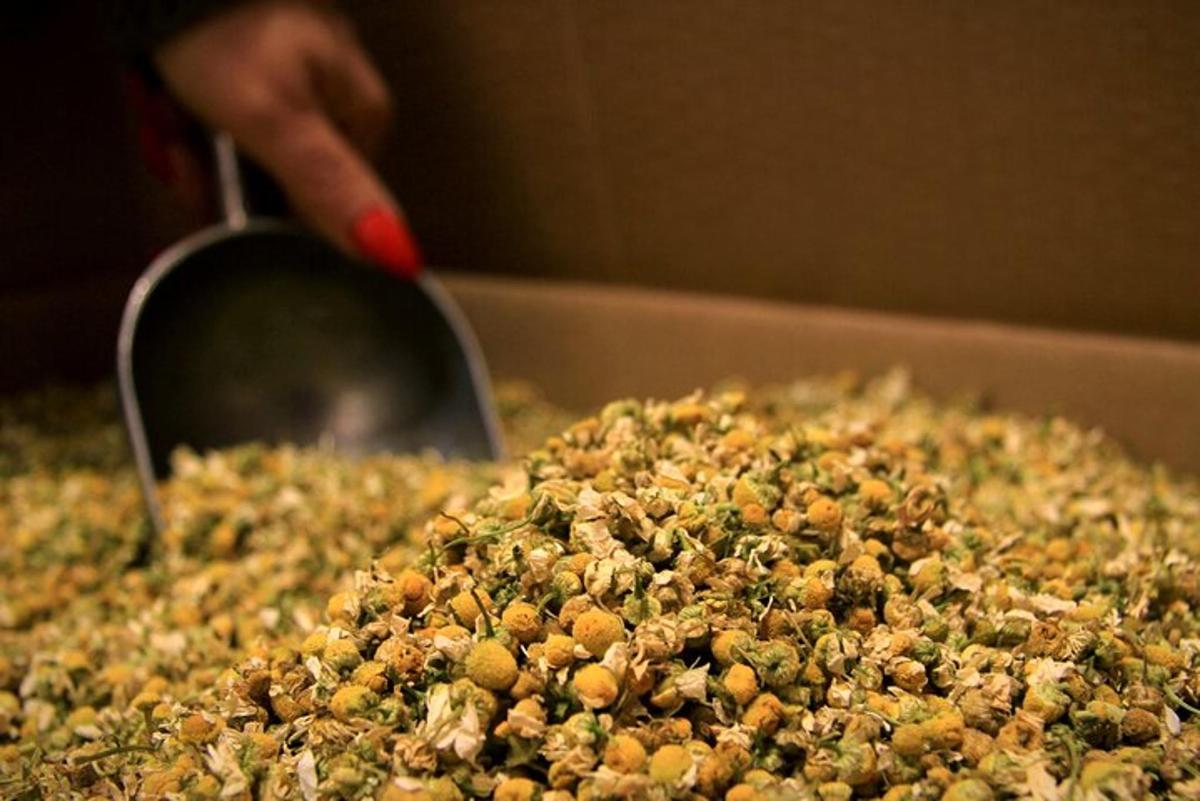 a pile of nuts on top of a pizza
