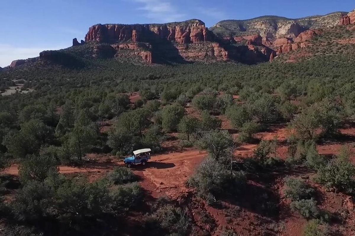 an aerial view of a truck parked in the desert