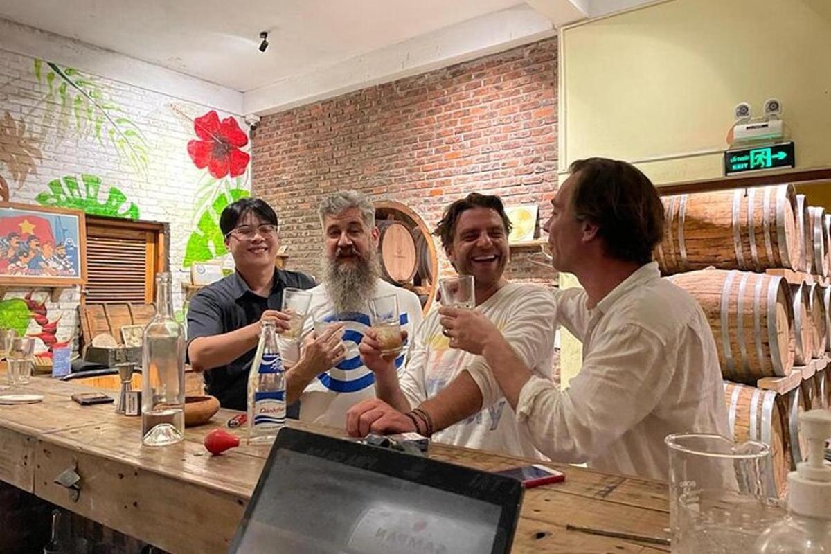 a group of people sitting at a table with wine glasses