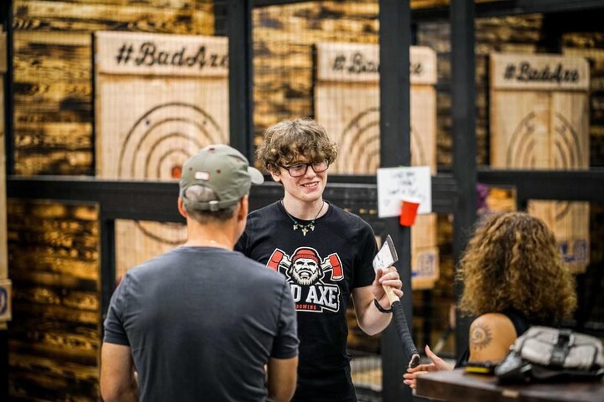 a man standing in a store talking to two people