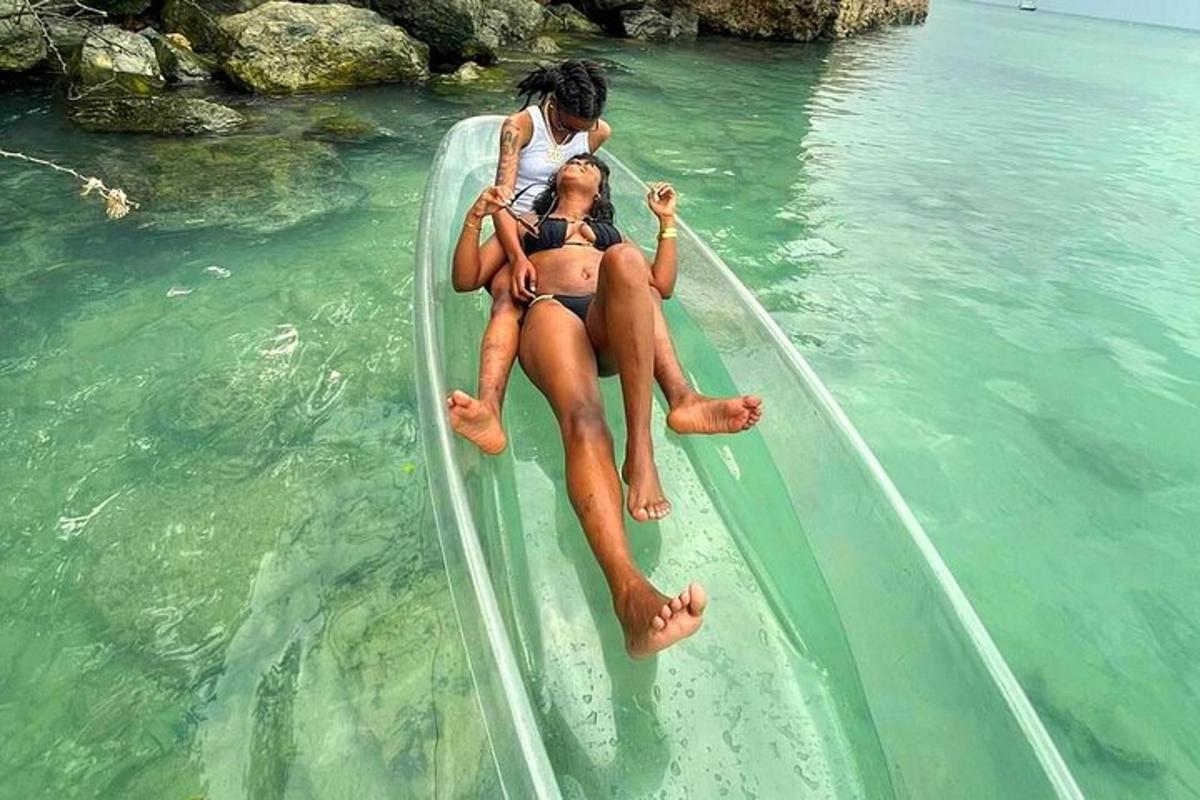 two people sitting on a boat in the water