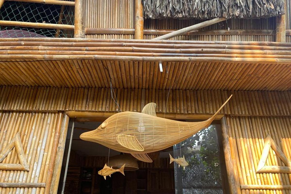 a large fish hanging from the side of a building
