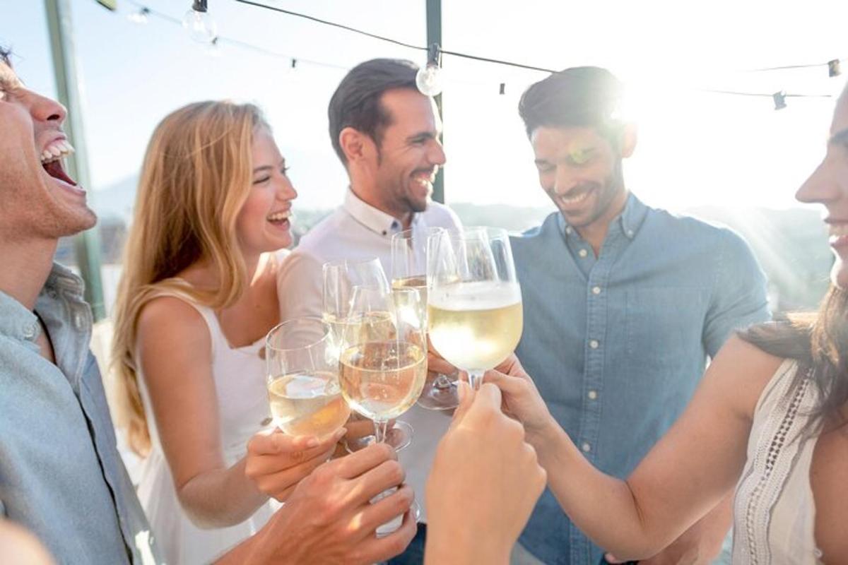 a group of people holding glasses of wine