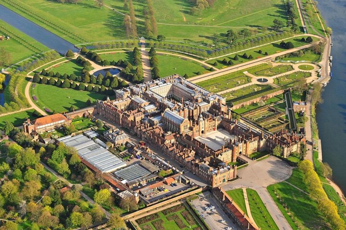 an aerial view of a large castle in the middle of a river