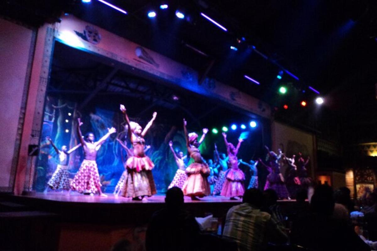 a group of women in dresses on a stage