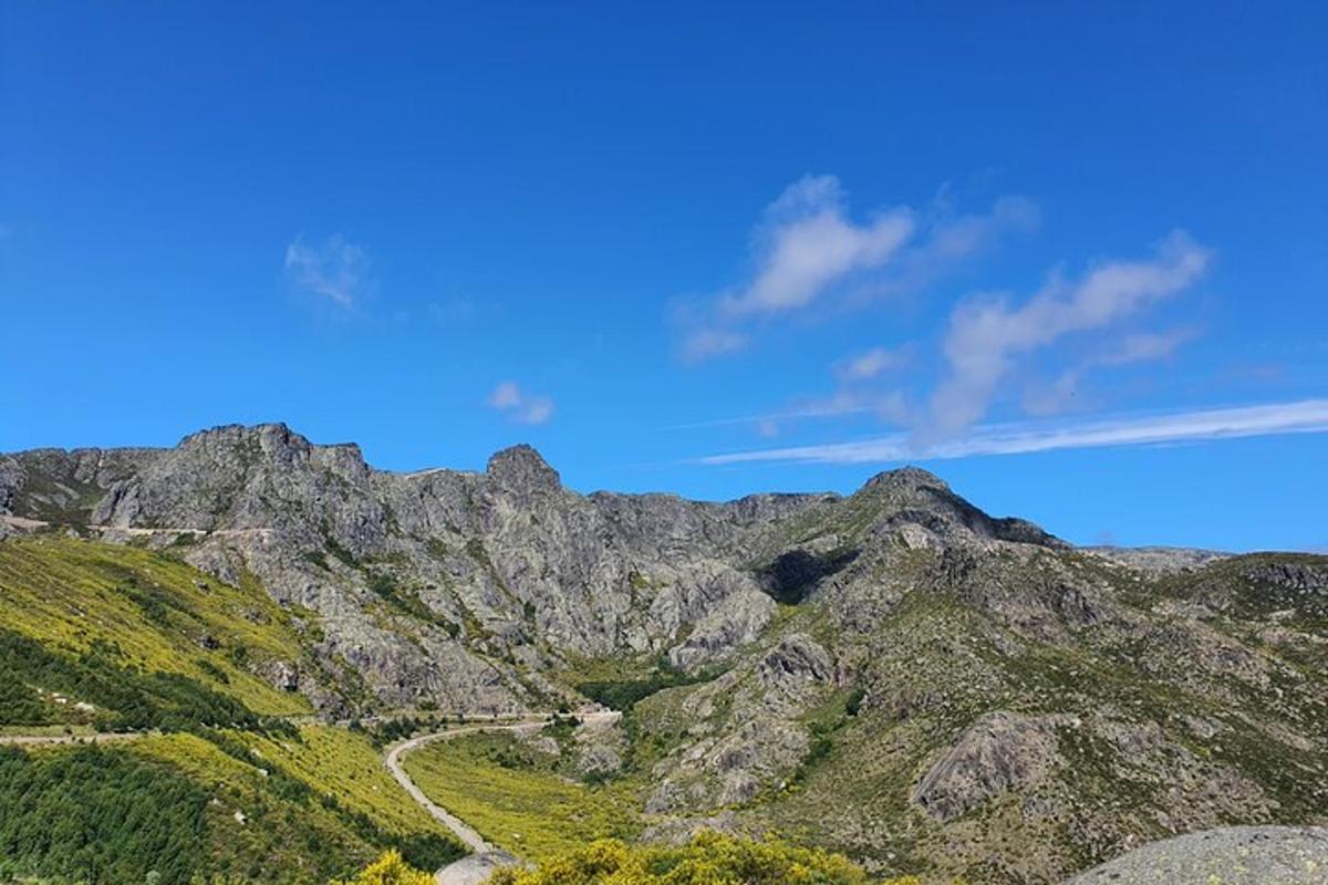 a view of a mountain with a road on it