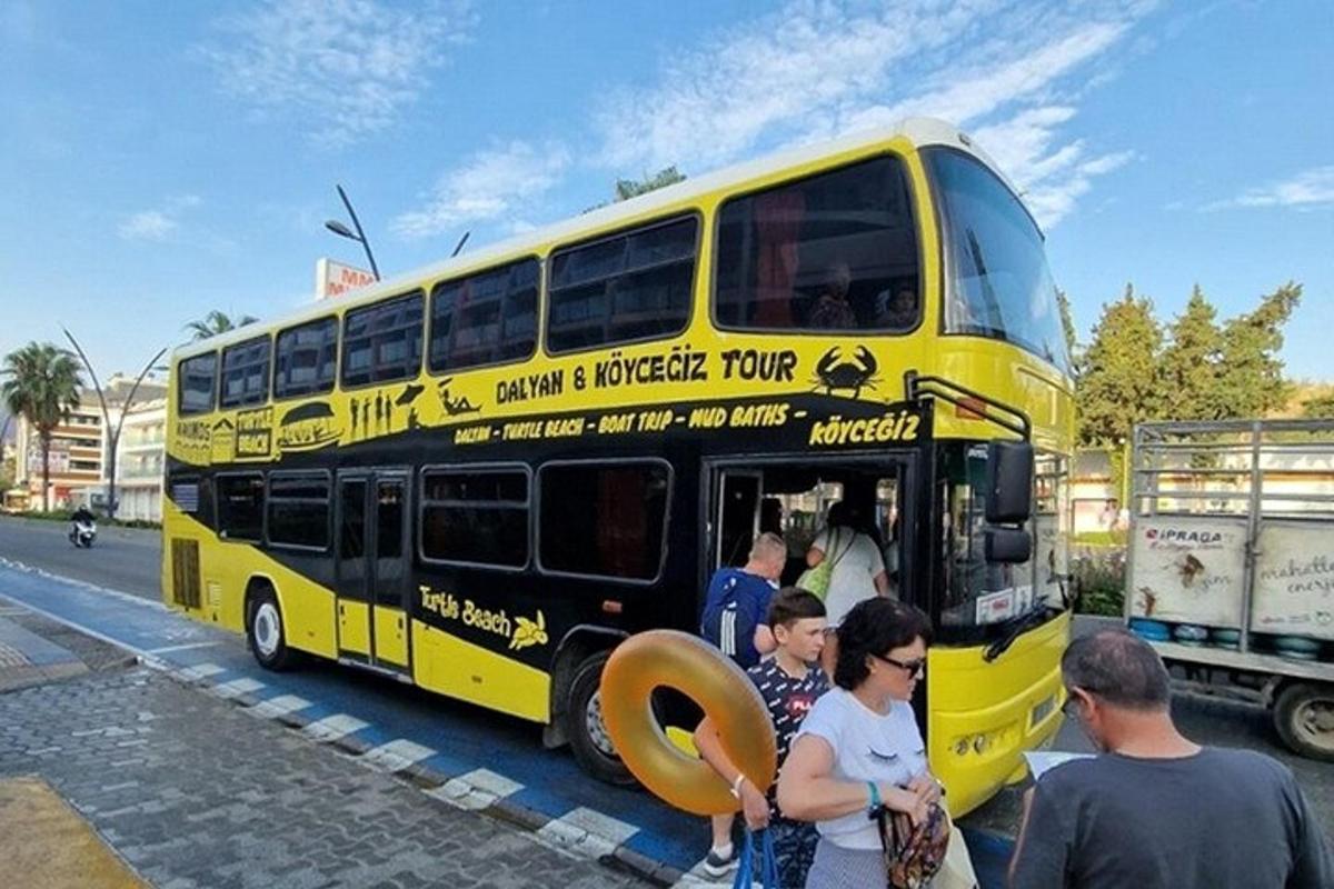 a yellow double decker bus parked on a street