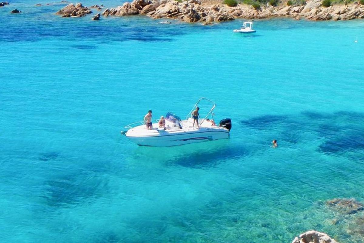 a group of people on a boat in the water