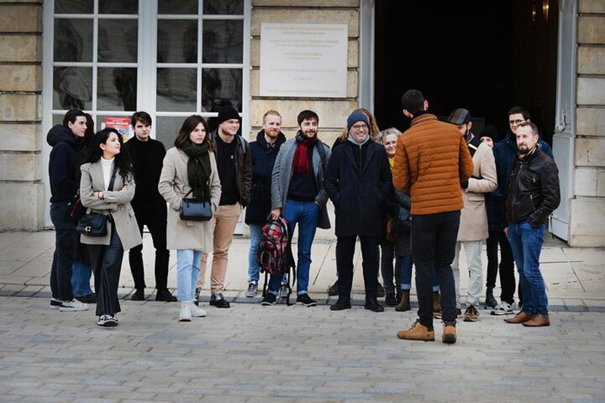 a group of people standing outside of a building