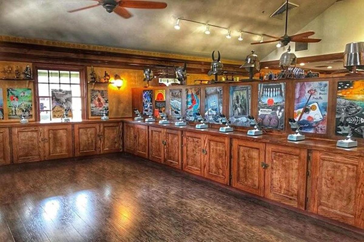 a room with a bunch of art on the walls