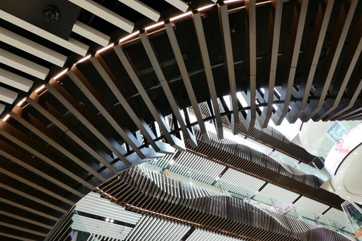a wooden ceiling with lights in a building